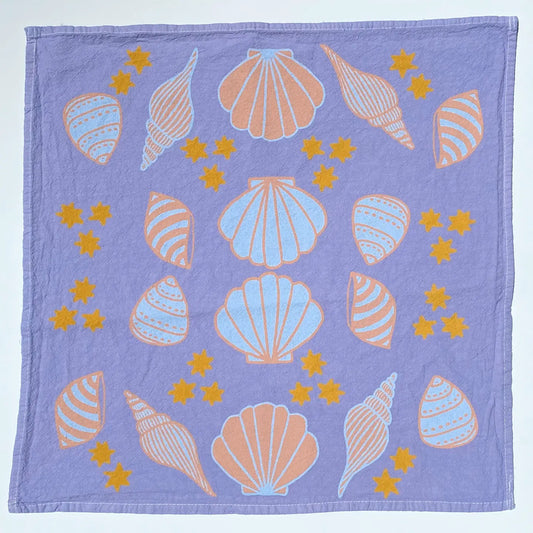 Magic Seashells Purple Tea Towel