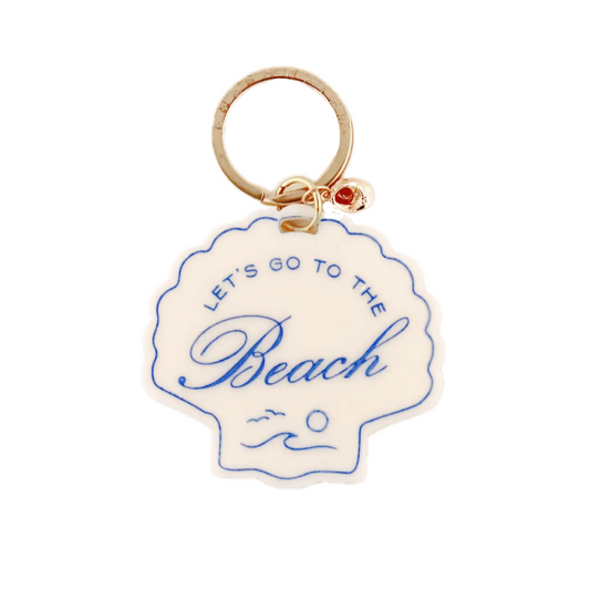 Keychain with 'Let's go to the Beach' text on a shell-shaped tag.